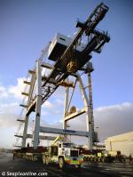 ID 1854 PORT OF AUCKLAND, NZ - The oldest container crane at the port is relocated by truck from the Axis Fergusson Container Terminal to the Axis Bledisloe terminal some half a mile away.